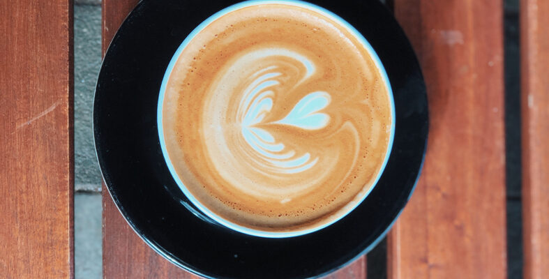 Beautiful,Foamy,Cappuccino,Art.,Coffee,In,A,Black,Cup,With